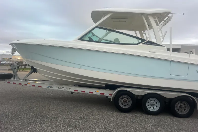 Slide: The Image of 2023 Boston Whaler 280 Vantage boat on a trailer, side view. - 25