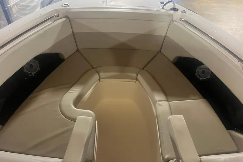 Slide: The Image of 2023 Boston Whaler 280 Vantage boat interior with beige seating and speakers. - 27