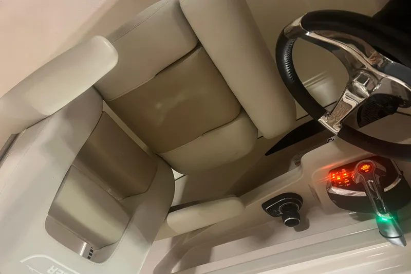 Slide: The Image of 2023 Boston Whaler 280 Vantage helm with steering wheel and controls. - 30