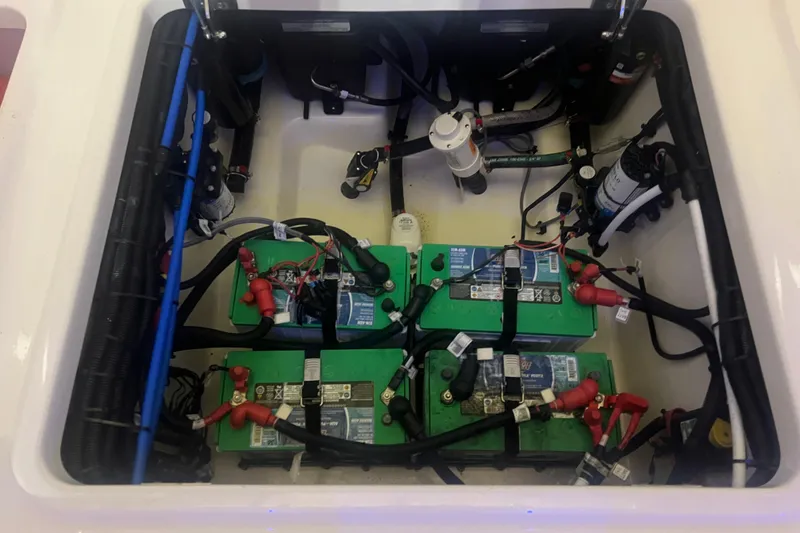 Slide: The Image of Battery compartment of 2023 Boston Whaler 280 Vantage with wiring and components. - 39