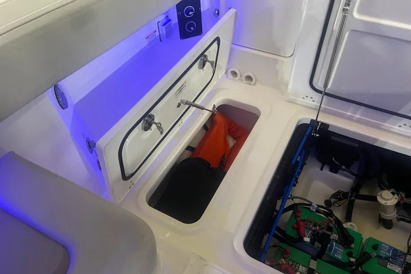 Slide: The Image of 2023 Boston Whaler 280 Vantage interior storage and battery compartment. - 41