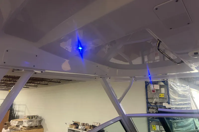 Slide: The Image of 2023 Boston Whaler 280 Vantage interior with blue LED lights and sleek design. - 44