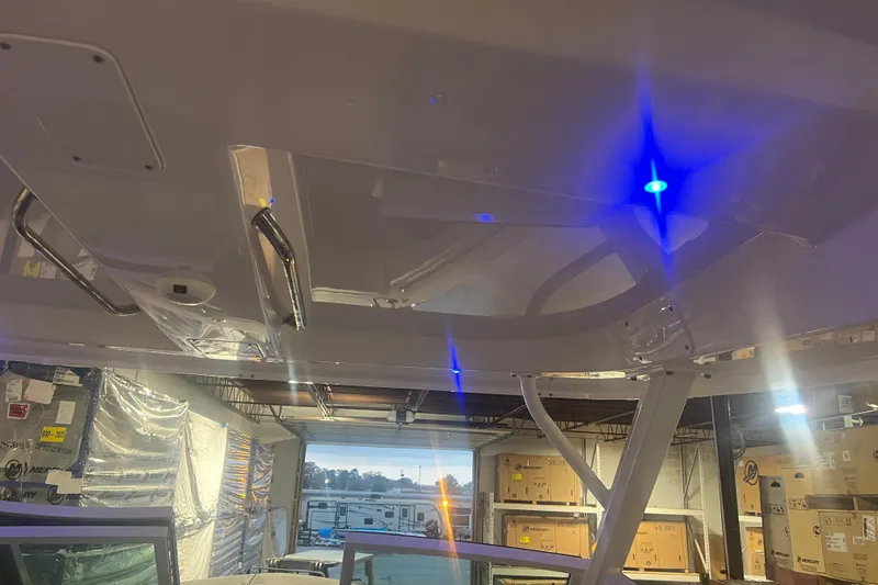 Slide: The Image of 2023 Boston Whaler 280 Vantage boat interior with blue LED lighting. - 45