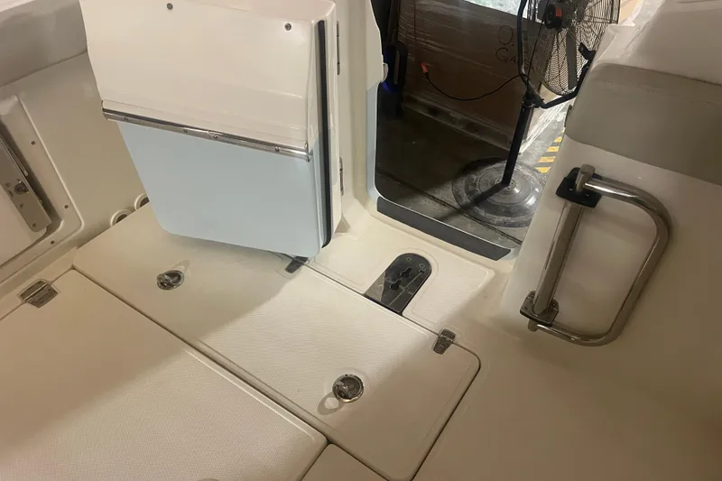 Slide: The Image of 2023 Boston Whaler 280 Vantage interior, featuring seating and storage compartments. - 49