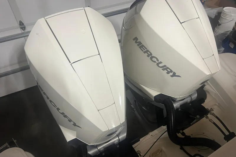 Slide: The Image of Twin Mercury outboard engines on a 2023 Boston Whaler 280 Vantage boat. - 51