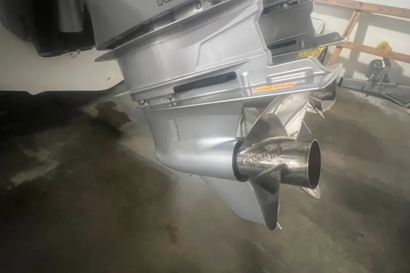 Slide: The Image of Close-up of a 2023 Boston Whaler 280 Vantage boat propeller in a garage. - 57