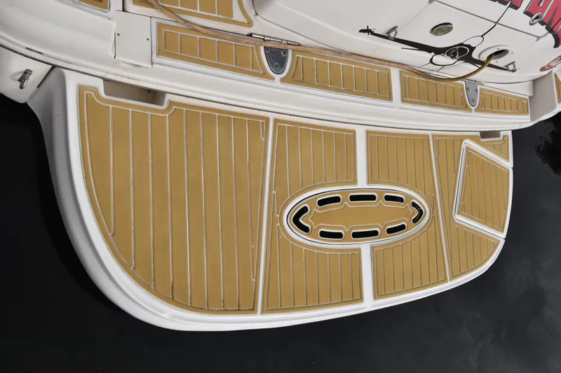 Slide: The Image of Swim platform of 2006 Sea Ray 320 Sundancer with tan decking. - 5