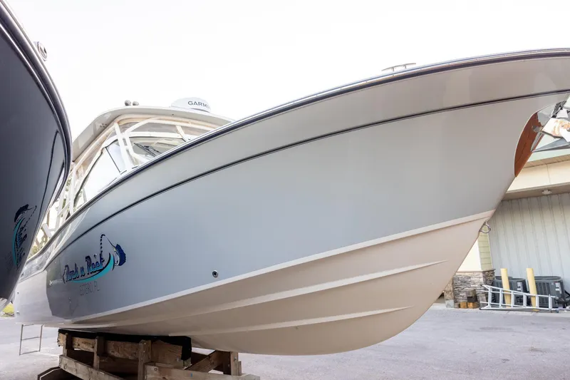 Slide: The Image of 2024 Grady-White Freedom 307 boat on display, showcasing sleek design and modern features. - 2