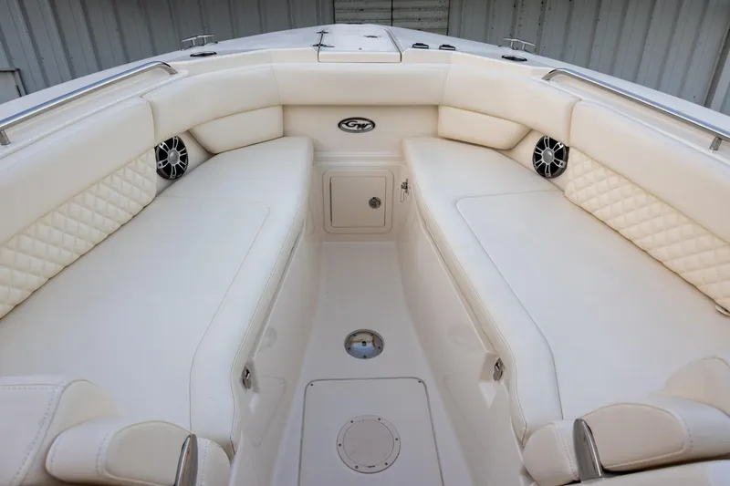 Slide: The Image of Luxurious seating area on 2024 Grady-White Freedom 307 boat, featuring elegant white upholstery. - 20