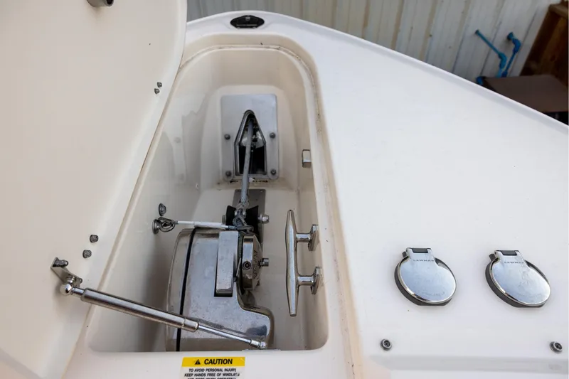 Slide: The Image of 2024 Grady-White Freedom 307 boat anchor compartment with stainless steel fittings. - 21