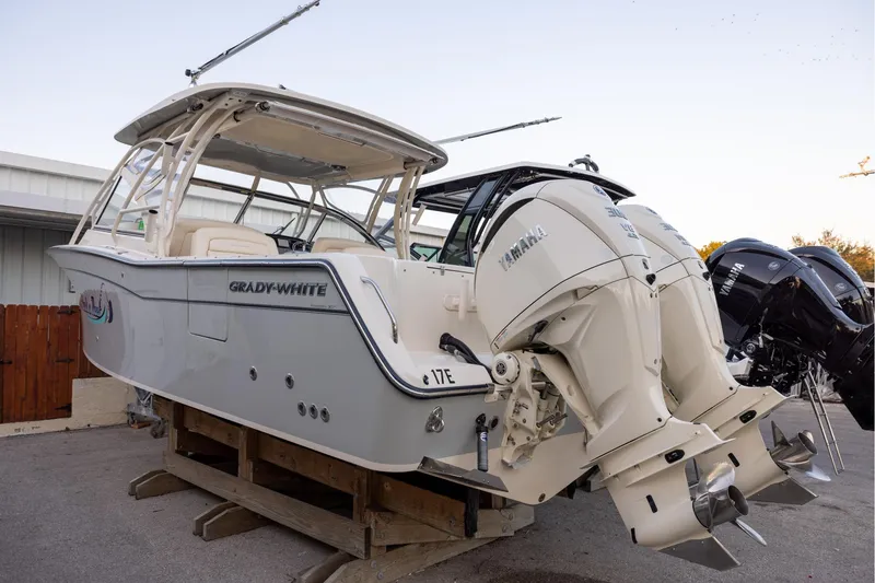 Slide: The Image of 2024 Grady-White Freedom 307 boat with dual Yamaha outboard engines on display. - 3
