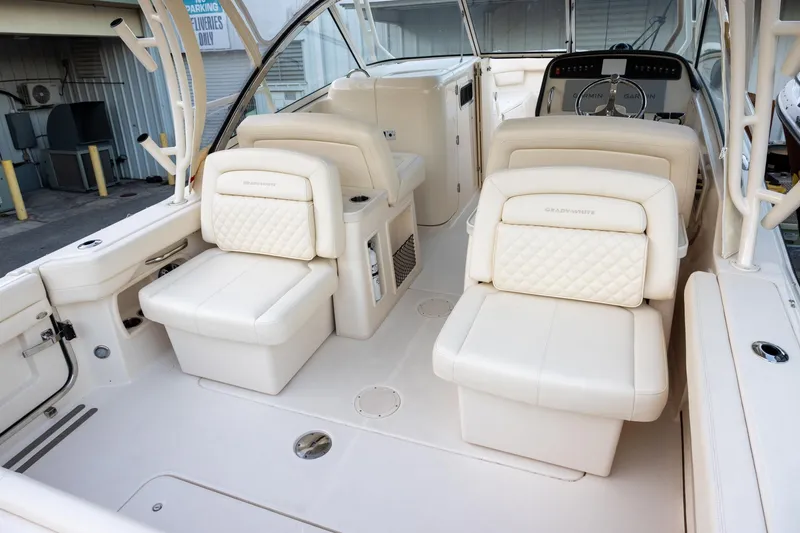 Slide: The Image of 2024 Grady-White Freedom 307 boat interior with luxurious seating and helm. - 5