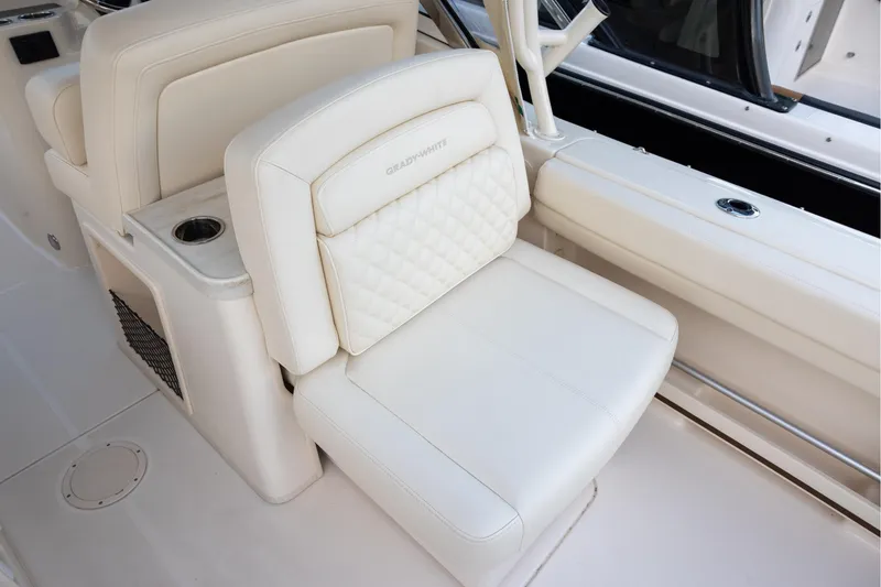 Slide: The Image of 2024 Grady-White Freedom 307 boat seat with cup holder and quilted design. - 8