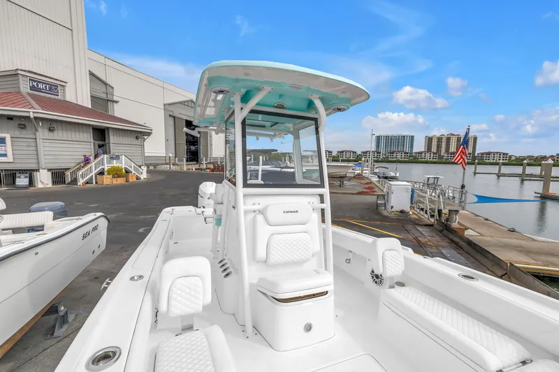 Slide: The Image of 2025 Caymas 28 HB boat docked at marina with clear blue sky. - 17