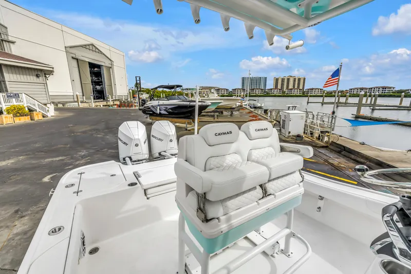 Slide: The Image of 2025 Caymas 28 HB boat docked at marina with dual Mercury engines. - 32