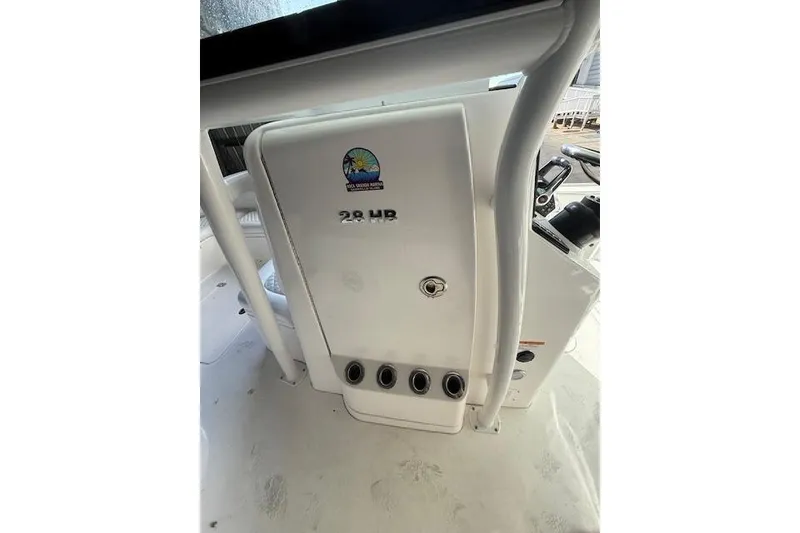 Slide: The Image of 2025 Caymas 28 HB boat docked at marina with clear blue sky. - 8