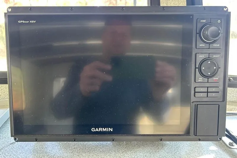 Slide: The Image of Garmin GPSMAP XSV device on 2004 Boulton Explorer 24 boat dashboard. - 11