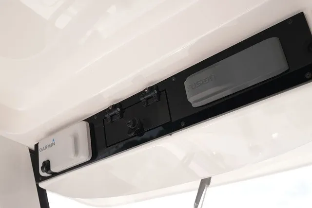 Slide: The Image of Close-up of a helm console with Garmin and Fusion devices on an Edgewater 262CC boat. - 18