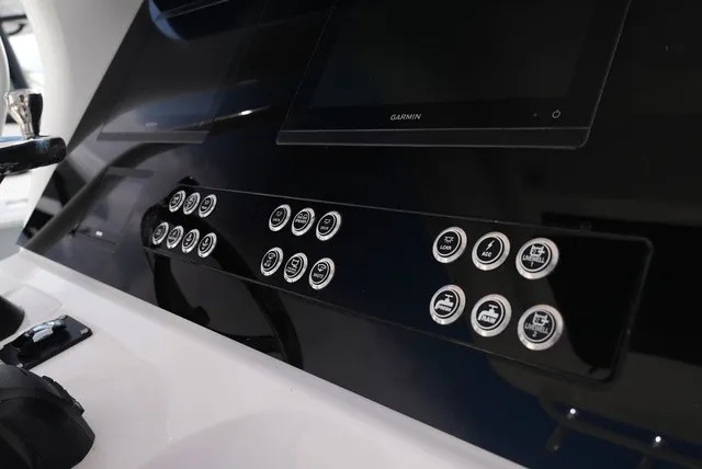 Slide: The Image of The image shows the dashboard of an Edgewater 262CC boat with modern controls and a screen. - 17