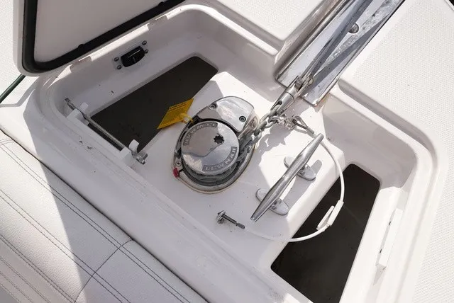Slide: The Image of Close-up of an anchor locker with a windlass on an Edgewater 262CC boat. - 24