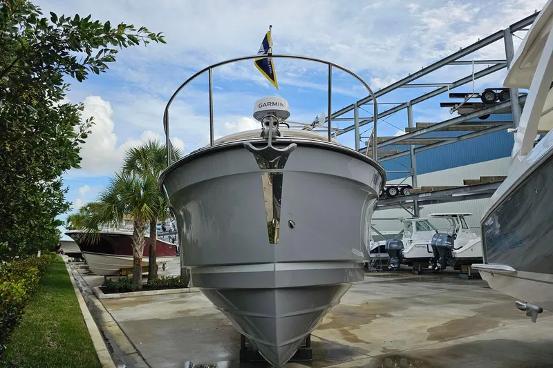 Slide: The Image of 2025 Ranger Tugs R-27 boat docked, showcasing sleek design and modern features. - 4