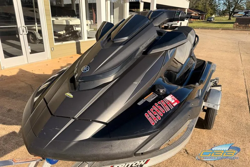 Slide: The Image of 2021 Yamaha WaveRunner FX SVHO jet ski on a trailer, parked outdoors. - 1