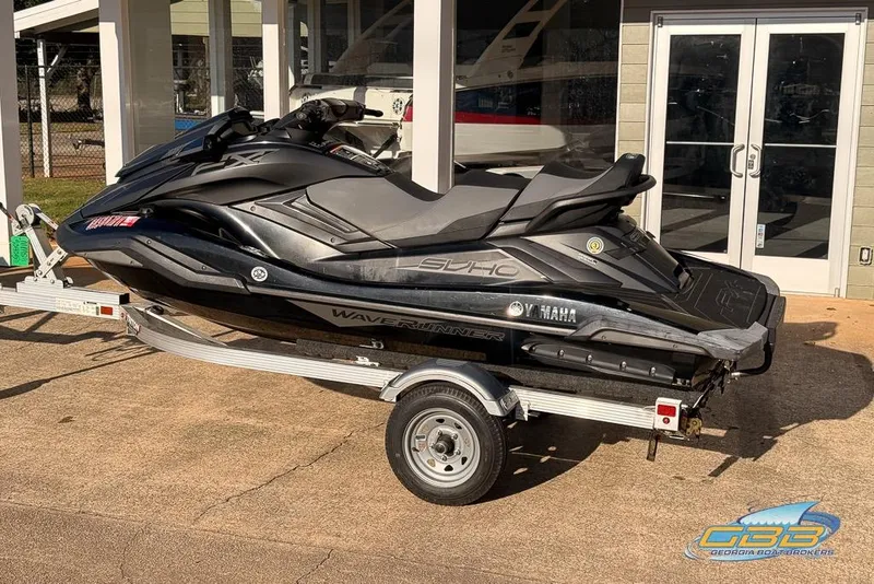 Slide: The Image of 2021 Yamaha WaveRunner FX SVHO on trailer, parked outside a building. - 2