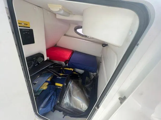 Slide: The Image of Interior storage compartment of a 2011 Sea Ray 300 Sundeck boat with life jackets. - 18