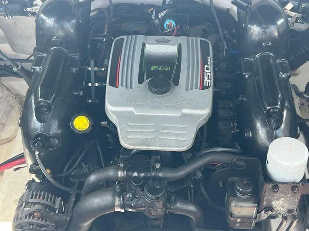 Slide: The Image of Engine of a 2011 Sea Ray 300 Sundeck boat, featuring a 350 MAG motor. - 23