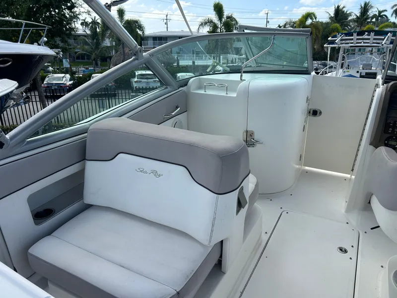Slide: The Image of 2011 Sea Ray 300 Sundeck interior with seating and helm, showcasing luxury boat design. - 8