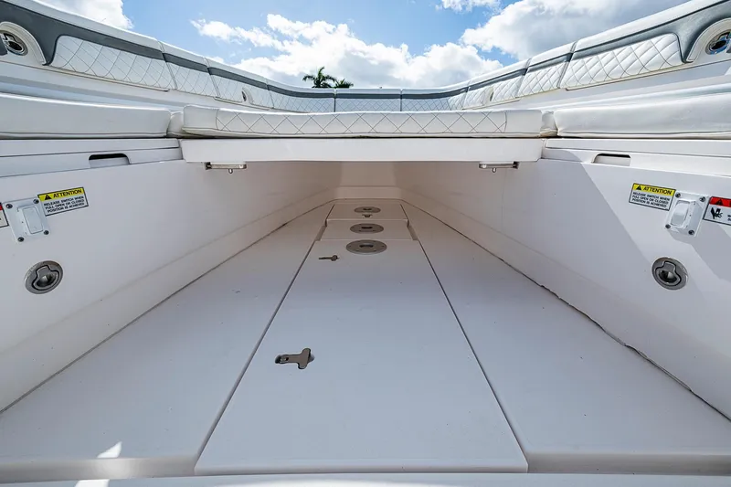 Slide: The Image of 2019 Intrepid 407 Nomad FE boat interior with spacious storage compartment. - 14
