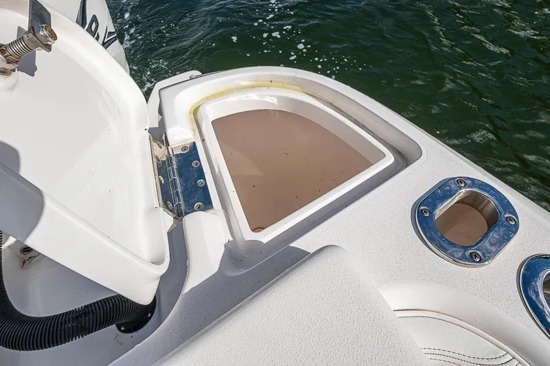 Slide: The Image of 2019 Intrepid 407 Nomad FE boat deck with open storage compartment. - 15