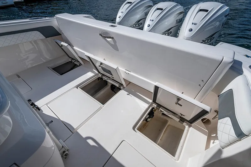 Slide: The Image of 2019 Intrepid 407 Nomad FE boat with open storage compartments and Yamaha engines. - 20
