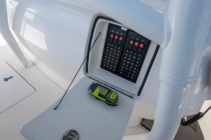 Slide: The Image of 2019 Intrepid 407 Nomad FE boat control panel with emergency beacon. - 35