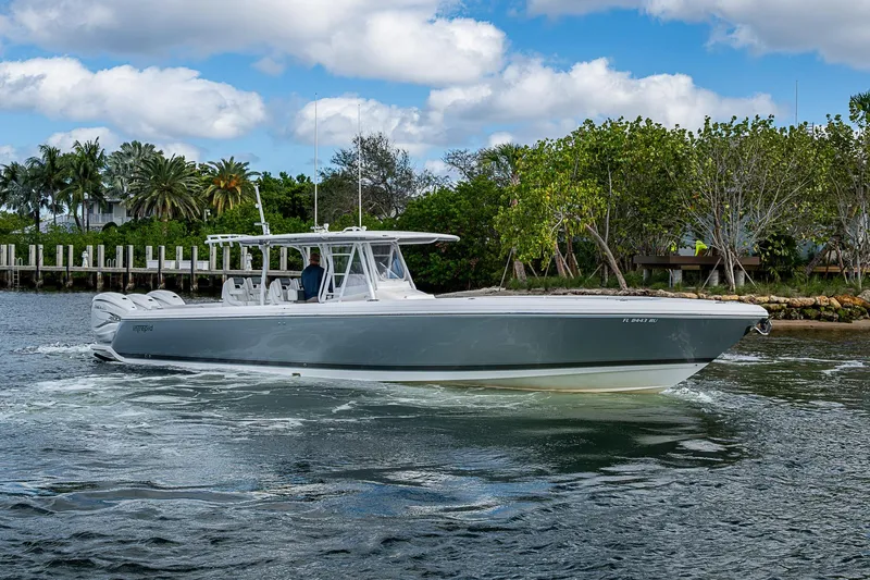 Slide: The Image of 2019 Intrepid 407 Nomad FE boat cruising on a scenic waterway. - 41