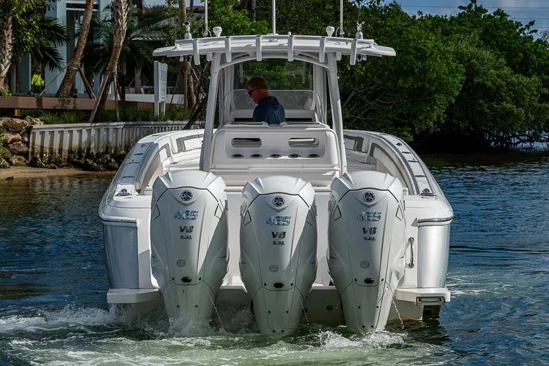 Slide: The Image of 2019 Intrepid 407 Nomad FE boat with triple Yamaha 425 V8 engines on water. - 55