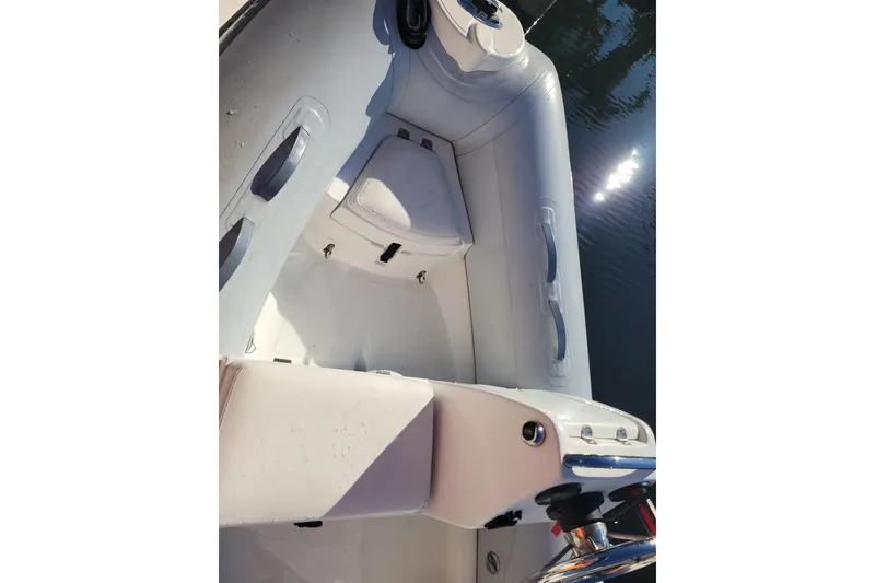 Slide: The Image of 2017 AB Inflatables Mares 10 VSX boat with Yamaha 25 outboard motor docked by water. - 7