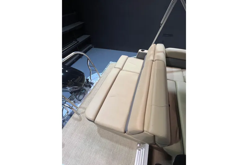 Slide: The Image of 2022 Harris Cruiser 230 boat interior with beige seating and sleek design. - 11