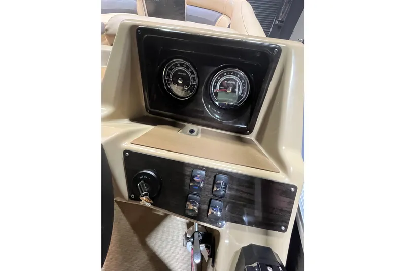 Slide: The Image of 2022 Harris Cruiser 230 dashboard with gauges and controls. - 13
