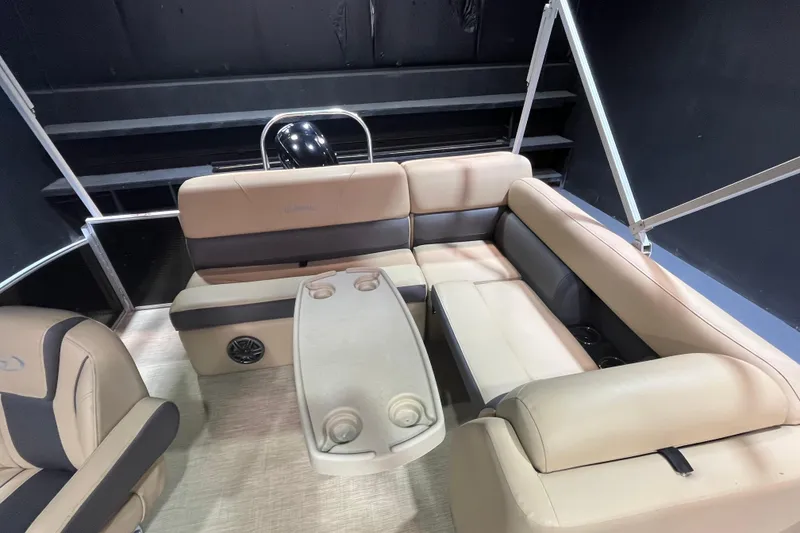 Slide: The Image of 2022 Harris Cruiser 230 interior with beige seating and table, showcasing luxury and comfort. - 9