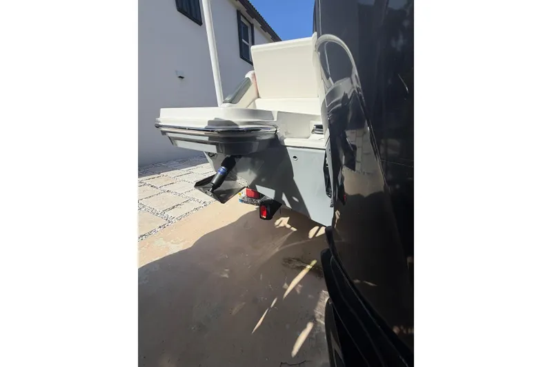 Slide: The Image of 2022 Trophy 2203 Center Console boat parked beside a building. - 15