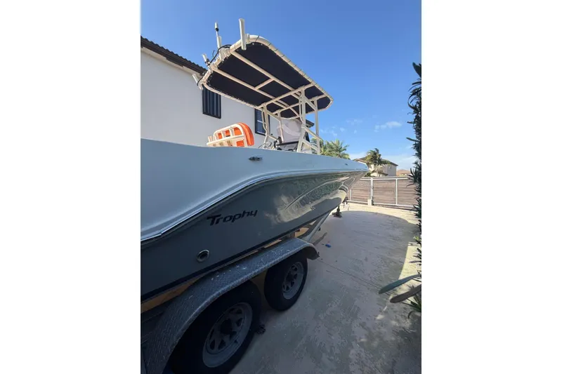 Slide: The Image of 2022 Trophy 2203 Center Console boat on trailer, parked outdoors. - 5