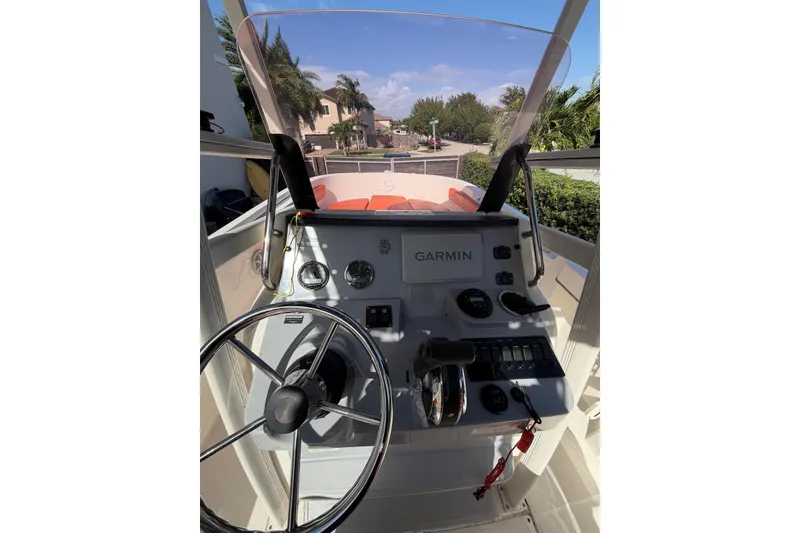Slide: The Image of 2022 Trophy 2203 Center Console boat dashboard with Garmin navigation system. - 8