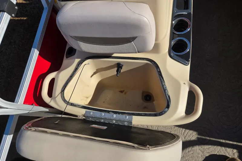 Slide: The Image of 2014 Sun Tracker Bass Buggy 16 DLX boat seat with storage compartment open. - 10