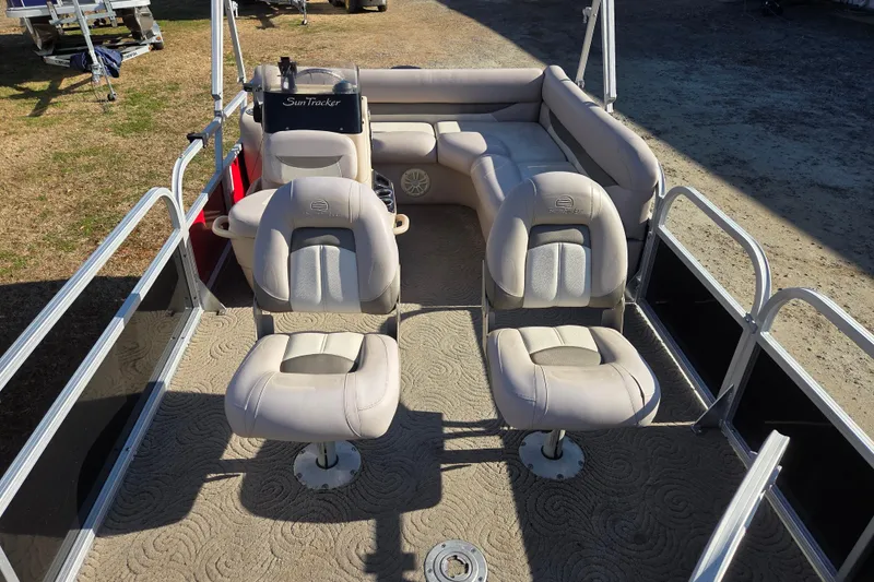 Slide: The Image of 2014 Sun Tracker Bass Buggy 16 DLX pontoon boat interior with seating. - 12