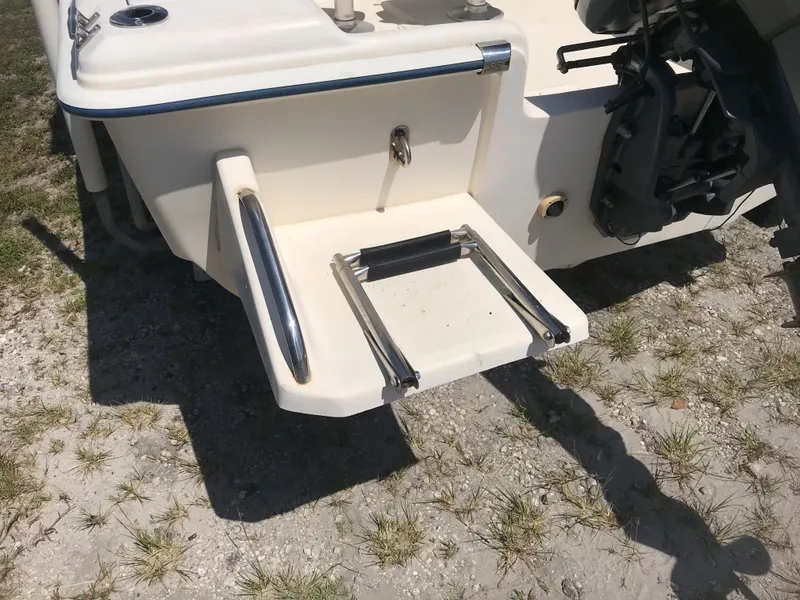 Slide: The Image of Rear view of a 2001 Scout 185 Sportfish with swim ladder. - 12