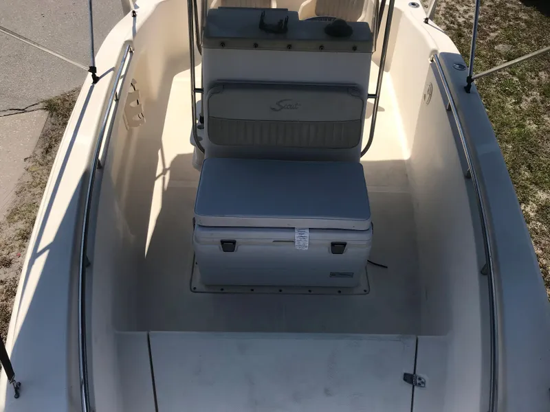 Slide: The Image of Scout 185 Sportfish 2001 interior view with seating and storage. - 18