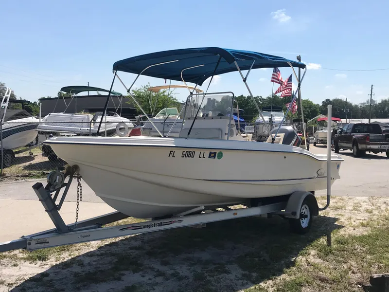 Slide: The Image of 2001 Scout 185 Sportfish on trailer with blue canopy. - 4