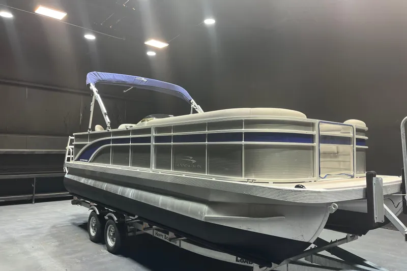 The Image of 2023 Bennington 22 FS pontoon boat on trailer in indoor setting. - 1