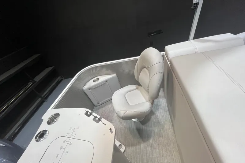 Slide: The Image of 2023 Bennington 22 FS boat interior with seating and control panel. - 10